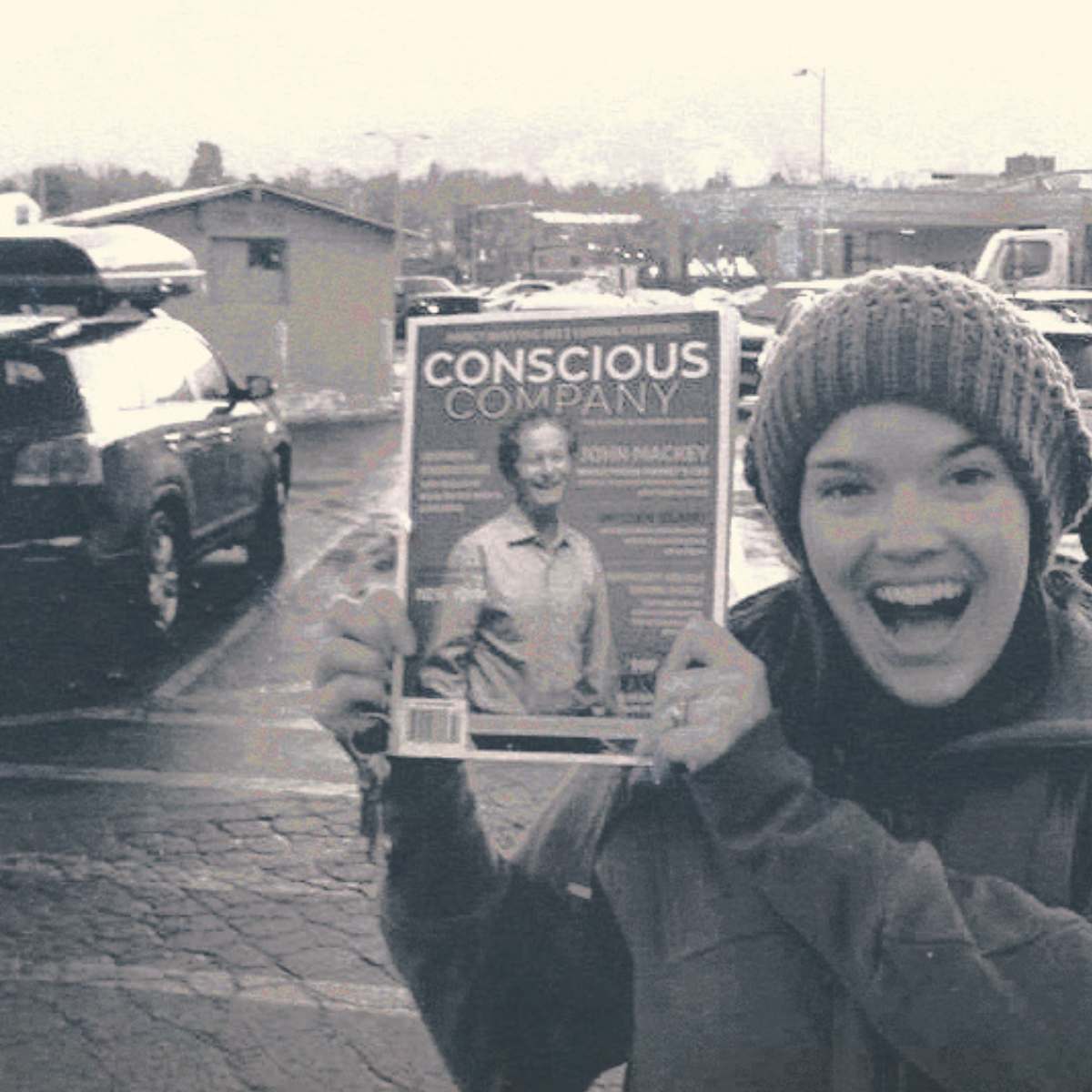A young Meghan French Dunbar holding the first print issue of Conscious Company magazine