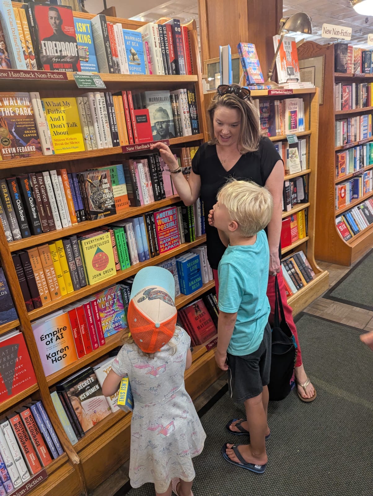 A family reading This Isn't Working together in a bookstore