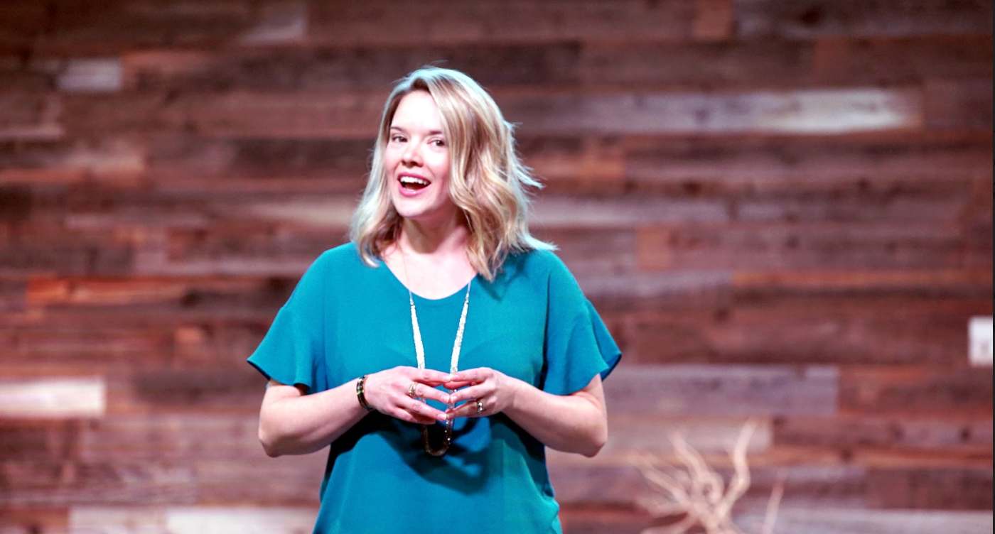 Meghan speaking on stage