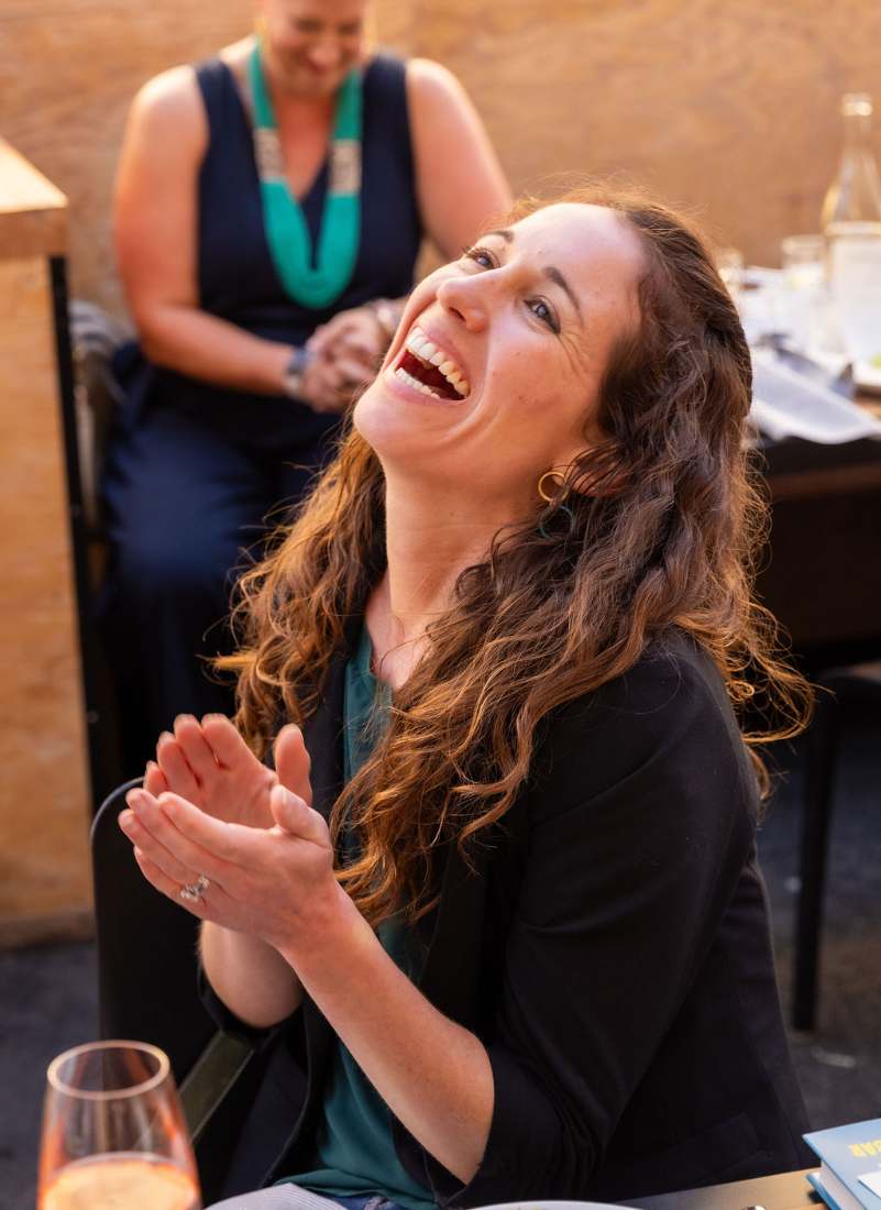 A guest laughing during the panel