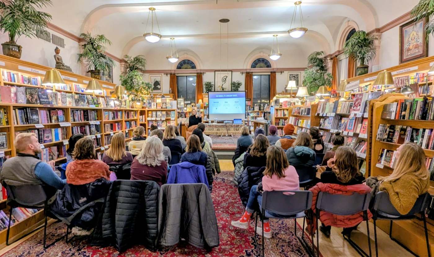 A packed crowd at a bookstore salon talk